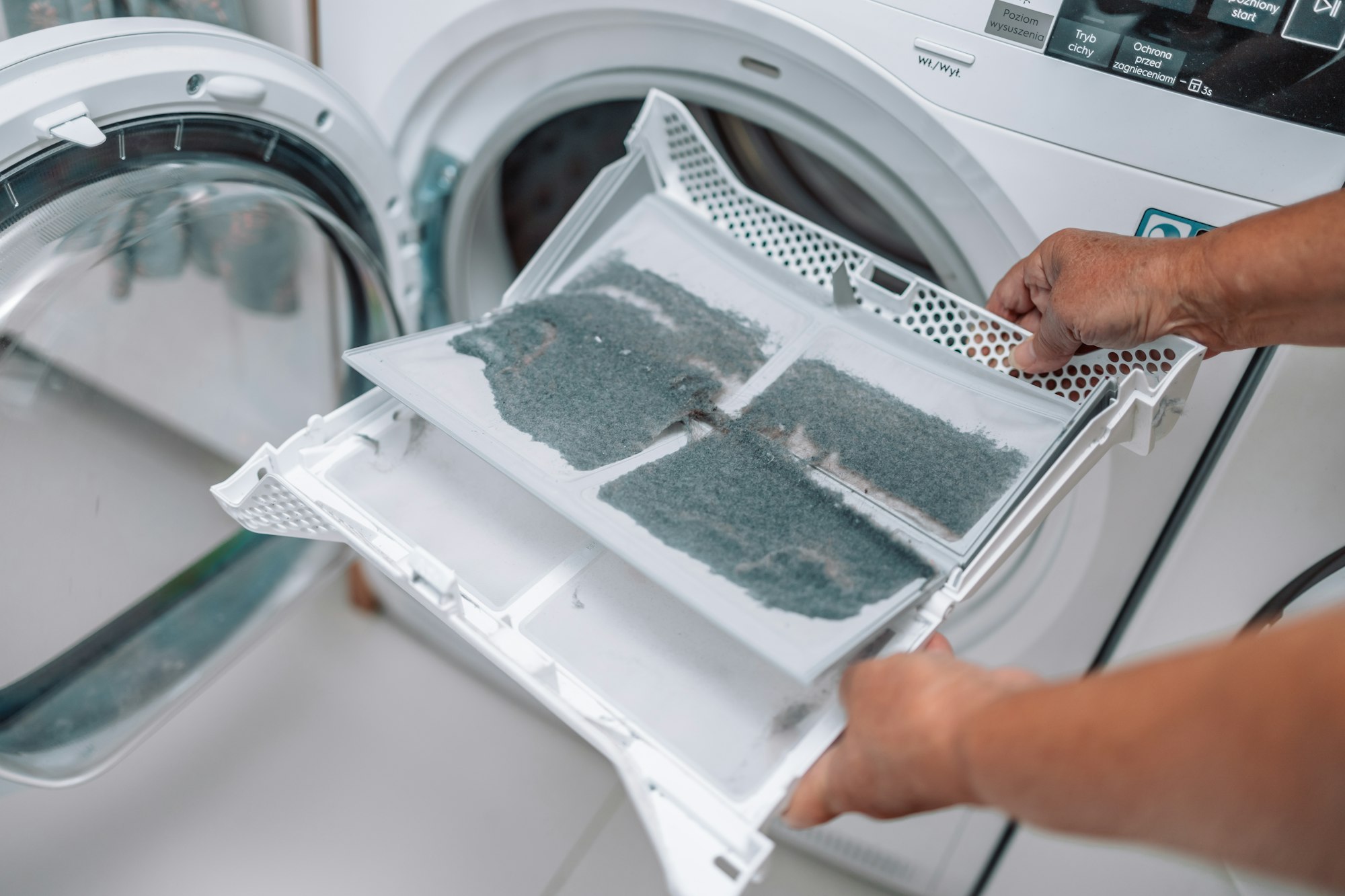 Dust and dirt trapped by the clothes dryer filter.